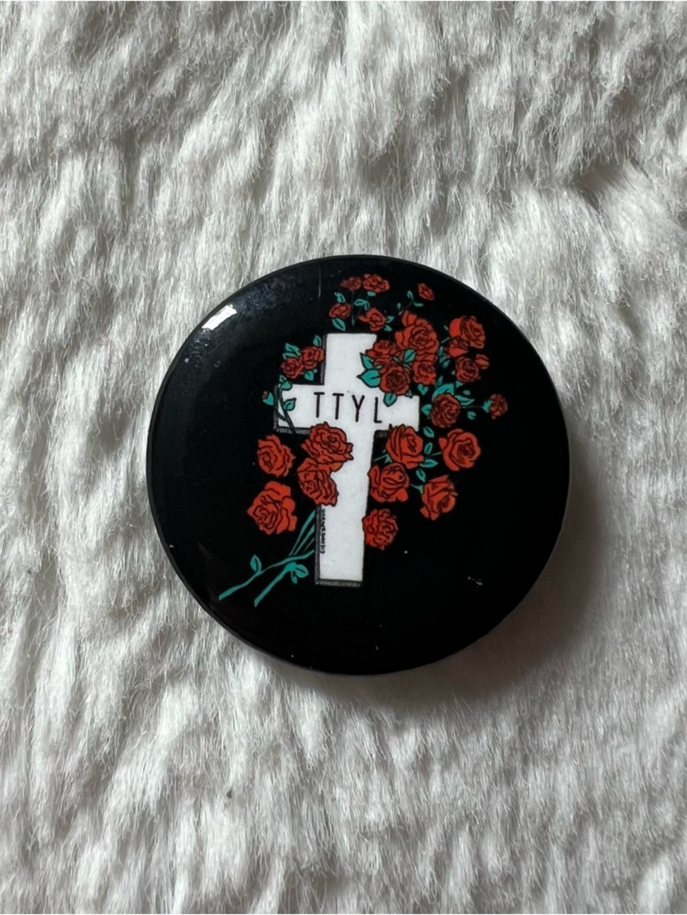 Black Round Pin/Button with White Cross and Red Roses